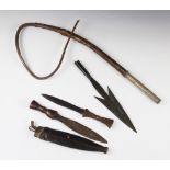 Two West African Nigerian Ekoi or Keaka knives, a tribal whip with decorated brass handle and a