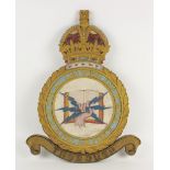ROYAL AIR FORCE INTEREST: A post World War I relief carved and painted wooden wall badge for the