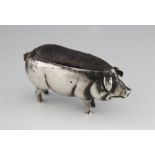 An Edwardian silver novelty pig in cushion, Adie & Lovekin, Birmingham 1905, 7cm long, weight 1.
