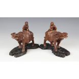 A pair of Chinese boy and buffalo carvings, 20th century, each typically modelled and upon