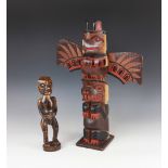 A Native American North West coast carved cedar wood figure, 29cm high, and a large painted wooden