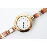 A George V ladies 9ct gold wristwatch, the round white dial with Roman numerals, set to a plain