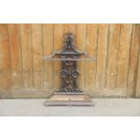 A Victorian Coalbrookdale style cast iron stick stand, the angular top rail upon a cast openwork