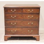 A George III mahogany chest of drawers, the rectangular moulded top above an arrangement of two