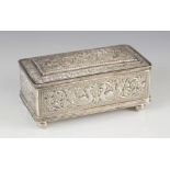 An Indian silver coloured jewellery casket, of rectangular form with hinged cover raised on four