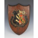 A hand painted coat of arms for Exeter College, Oxford, 19th century, painted directly to a shaped