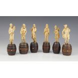 A set of six carved ivory bandsmen, Bavaria (19th century), each modelled standing atop a coppered
