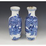 A pair of Chinese blue and white vases, 19th century, each of baluster form and decorated to the