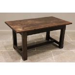 A 17th century style oak refectory table, 20th century, the rectangular slab top raised upon four