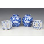 A pair of Chinese porcelain blue and white prunus pattern ginger jars and covers, each of typical