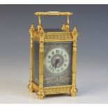 A late 19th century French brass cased carriage timepiece, the case with filigree detail and