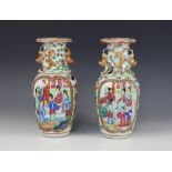 A pair of Chinese Canton vases, late 19th century, each of baluster form and decorated in the