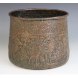 An Indian copper vessel, 19th century, of tapering form, the sides extensively decorated with a