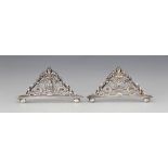 A pair of George V silver menu holders, William Hutton & Sons, Sheffield 1911, each of triangular
