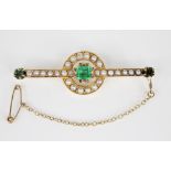A Victorian emerald, pearl and diamond brooch, the central rectangular step cut emerald measuring