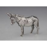 A silver figure of a donkey, S M D Castings, London 1974, modelled standing with fur effect chasing,