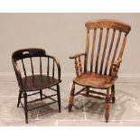 A Victorian stained elm and beech wood farmhouse Windsor chair, the lath back over a shaped seat,