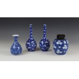 A pair of Japanese porcelain bottle vases, 20th century, each decorated in blue and white with