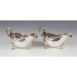 A pair of late Victorian silver sauce boats, Marston & Bayliss, Birmingham 1900, each of typical