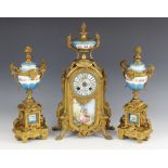 A French Louis XVI style gilt metal and bleu celeste porcelain clock garniture, late 19th century,