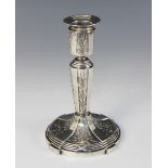 A German '800' standard Netter candlestick, early 20th century, embossed with a mistletoe design