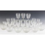 A suite of Victorian glasses, each with cut-bodies and spreading circular feet, to include a