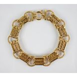 A continental gold coloured bracelet, comprising alternating pierced rectangular links and