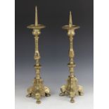 A near pair of brass pricket type ecclesiastical candlesticks, late 19th/early 20th century, each of