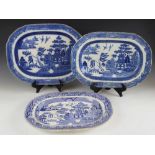 Thirteen blue and white Willow pattern meat plates, predominantly Staffordshire 19th century, each