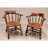Two Victorian elm and beech wood smokers bow elbow chairs, each with a horse shoe shaped top rail