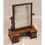 A mid 19th century mahogany dressing table mirror, the rectangular mirrored plate raised upon 'S'