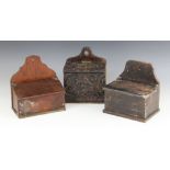 Three various salt boxes, 19th century and later, to include an oak example carved with relief