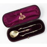 A Victorian silver christening set, William Edwards, London 1874, comprising caddy spoon and sugar