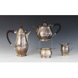 A silver tea service, Elkington & Co, Birmingham 1964-66, comprising teapot, coffee pot, sucrier and