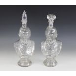 A pair of clear glass bust decanters, early 20th century, each modelled as a gentleman, on