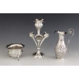 A late Victorian silver ewer, Maurice Freeman, London 1899, of baluster form with shaped border