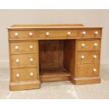 A Victorian pine twin pedestal dressing table, the rectangular moulded top above a central frieze