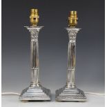 A pair of George V silver candlesticks, Ellis & Co, Birmingham 1921, converted into table lamps,