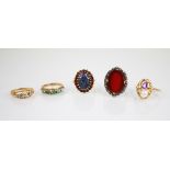 A sapphire and diamond 18ct gold ring, comprising two mixed cut sapphires and two mixed cut