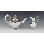 A Victorian silver teapot and milk jug, Roberts and Hall Sheffield 1852, each of plain polished