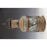 A maritime kerosene ships mast lantern by Anchor Patt, 1945, of typical cylindrical form with