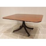 A Regency mahogany breakfast/centre table, the rectangular tilt top with rounded corners and a