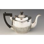 A late Victorian silver teapot, George Nathan & Ridley Hayes, Chester 1899, of oval form with half-