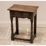 An 18th century and later constructed oak side table, the rectangular top above a single frieze