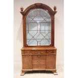 A Queen Anne style mahogany display cabinet, late 20th century, the arched top flanked by fruit