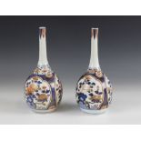 A pair of Japanese Imari vases, circa 1700, each of bottle form and decorated with ogee shaped