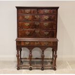 An early 18th century and later oak and walnut chest on stand, formed from two over three