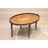 A George III and later mahogany tray top occasional table, the oval galleried tray centred with an