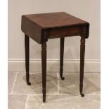 An early 19th century mahogany work table, the rectangular drop leaf top above a single frieze