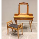 A Biedermeier style satin birch dressing table, mid 19th century, the rectangular mirrored plate